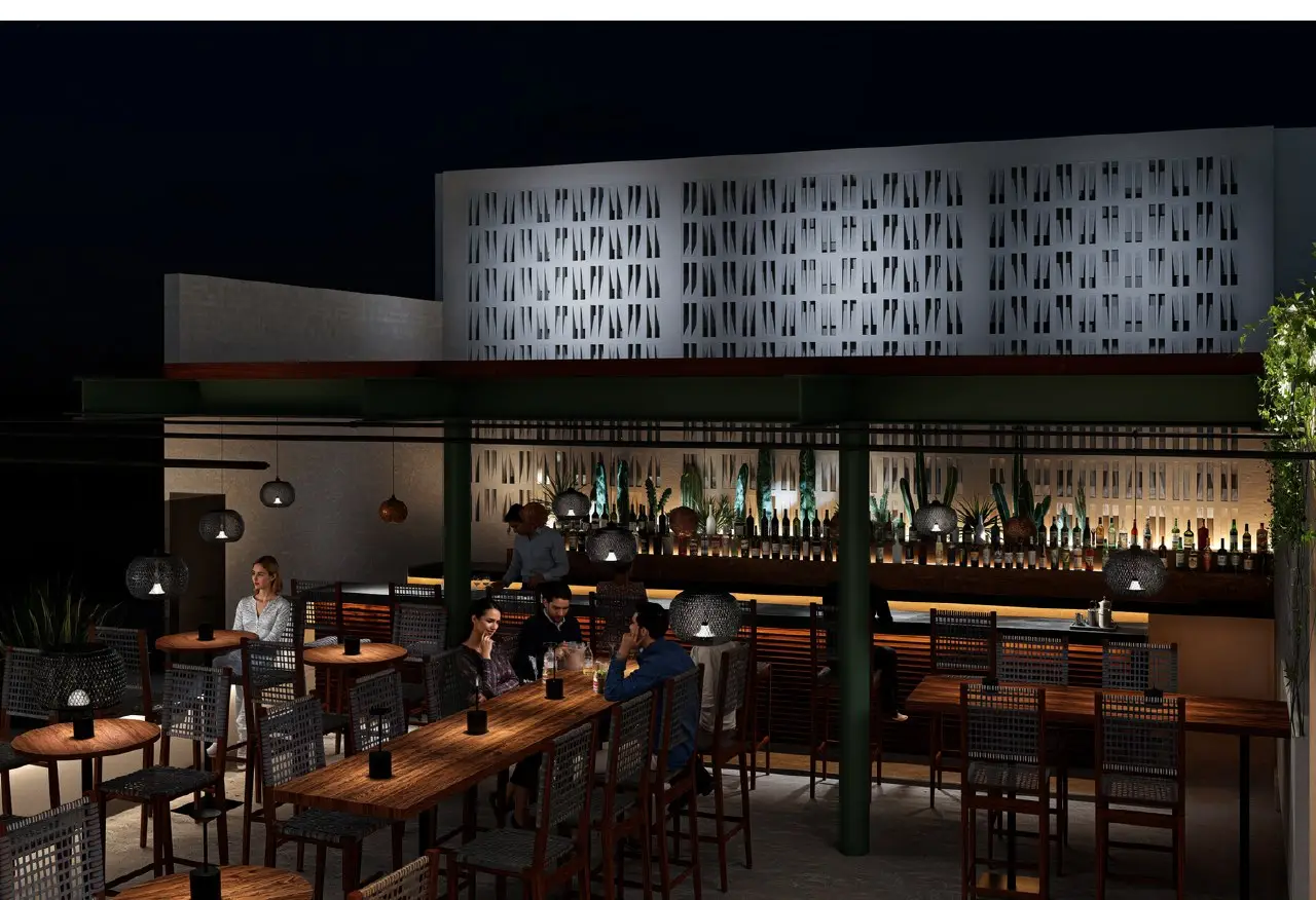 Outdoor bar at N'TRE Cocina al Fuego in Cabo San Lucas at night